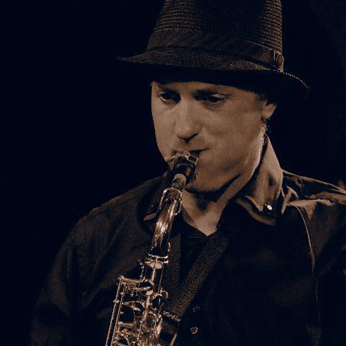 Photo of man playing the saxophone (Brent Rowan)